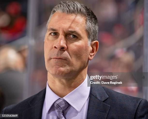 Head coach Jared Bednar of the Colorado Avalanche watches the action from the bench against the Detroit Red Wings during an NHL game at Little...