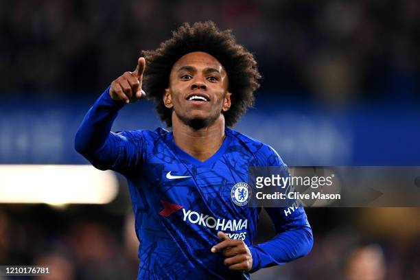 Willian of Chelsea celebrates after scoring his sides first goal during the FA Cup Fifth Round match between Chelsea FC and Liverpool FC at Stamford...