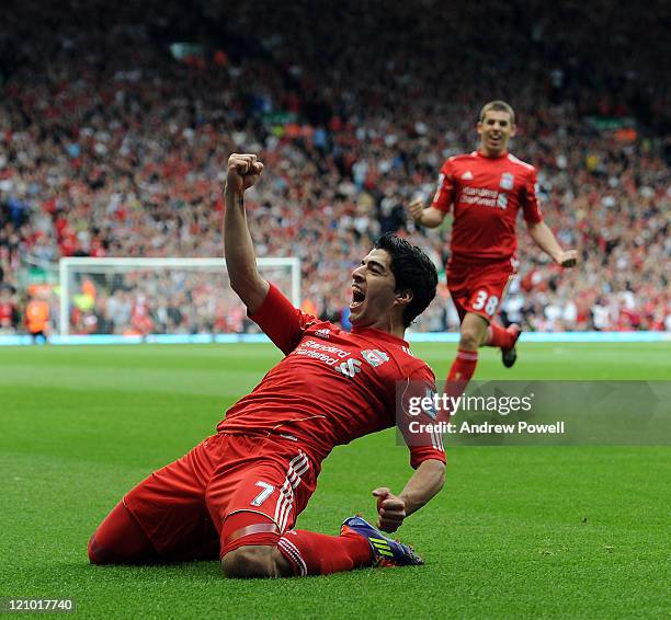 Luis Suarez of Liverpool celebrates scoring his team's opening goal during the Barclays Premier League match between Liverpool and Sunderland at...