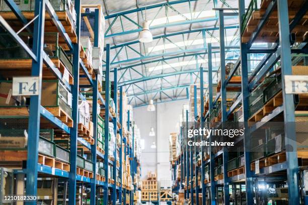 interior of a large distribution warehouse - modern warehouse stock pictures, royalty-free photos & images