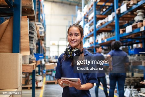 Confident female warehouse worker Confident female warehouse worker
