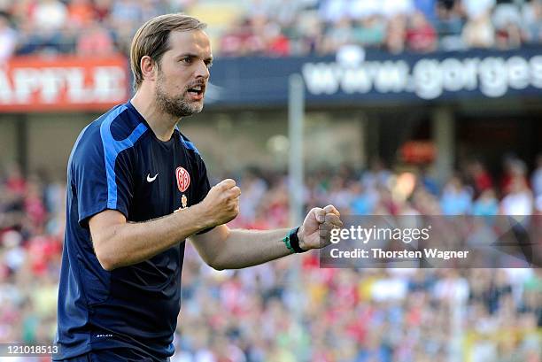 Head coach Thomas Tuchel of Mainz celebrates after winning the Bundesliga match between SC Freiburg and FSV Mainz 05 at Badenova Stadium on August...