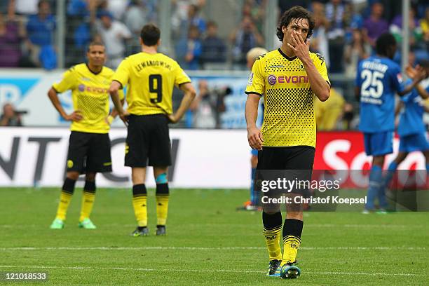 Mohamed Zidan, Robert Lewandowski and Mats Hummels of Dortmund look dejected after losing 0-1 the Bundesliga macht between TSG 1899 Hoffenheim and...