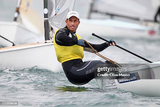 Ben Ainslie of Great Britain in action on his way to a gold medal in the Finn Class medal race on day twelve of the Weymouth and Portland...