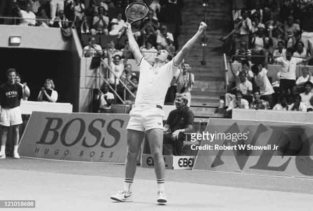 Tennis player John McEnroe celebrates during his 6 hour and 20 minute Davis Cup match against Germany's Boris Becker, in Hartford, CT, April 1987....
