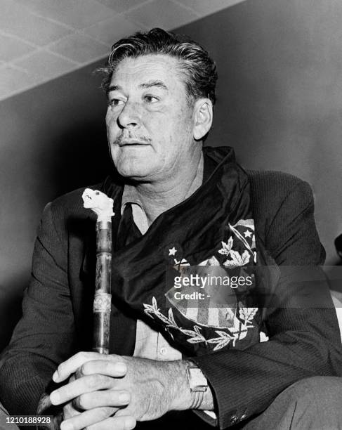 Portrait dated 12 January 1959 of American actor Errol Flynn , wearing an anti-Castro flag.