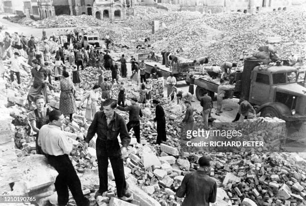 Photo dated 1945 showing residents and emergency personnel cleaning up the rubble in the east German city of Dresden, following allied bombings 13...