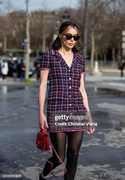 Brittany Xavier is seen wearing checkered dress, sheer tights outside Chanel during Paris Fashion Week - Womenswear Fall/Winter 2020/2021 : Day Nine...