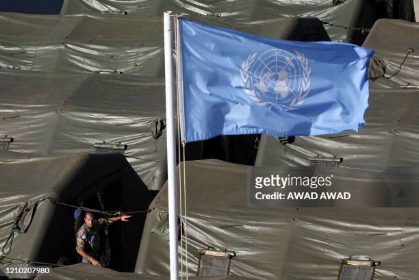 An Italian soldier walks between rows of tents at a military base near the southern Lebanese village of Srifa 03 September 2006. More Italian troops...