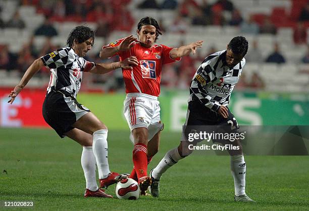 Boavista's Lucas Tiago and Benfica's Nuno Gomes battle for the ball during Portugese League play, Lisbon, Portugal, February 3, 2007.