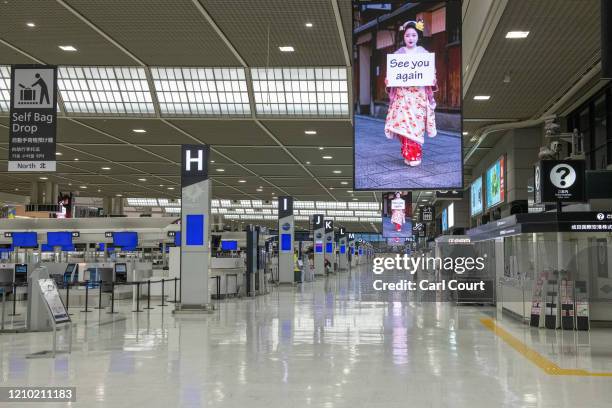 Departure terminal is pictured almost completely empty at Narita Airport on April 17, 2020 in Tokyo, Japan. Narita Airport, one of Japans busiest,...