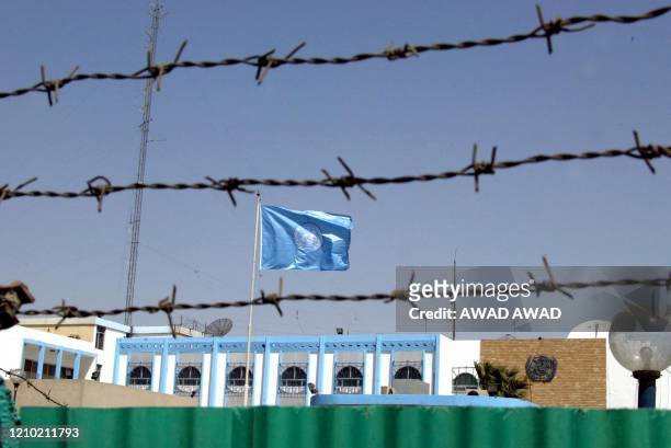 Picture shows the UN headquarters encircled with barbed wire in Baghdad 25 September 2002. The international spotlight has been thrown back on the UN...