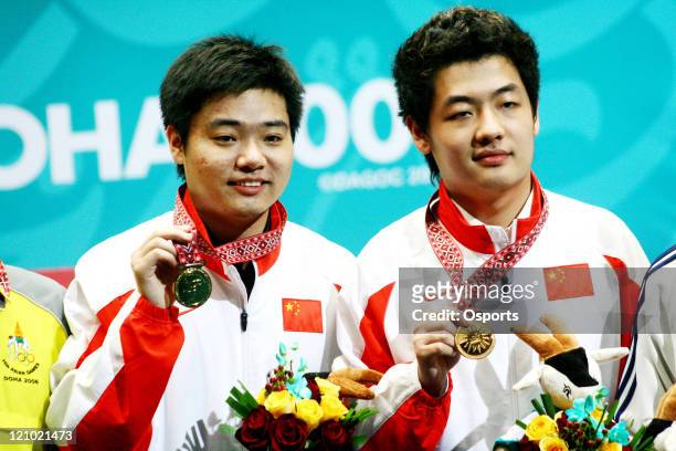 Ding Junhui and Tian Pengfei of China pose with their Gold Medals after the Men's Snooker Team match between China and Macau at the 15th Asian Games...