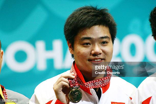 Ding Junhui of China with the Gold Medal after the Men's Snooker Team match between China and Macau at the 15th Asian Games in Doha, Qatar on...