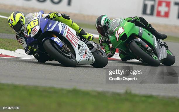 Valentino Rossi of Italy and Fiat Yamaha team and Randy De Puniet of France and Kawasaki Racing team in action during the Qualifying Practice at the...