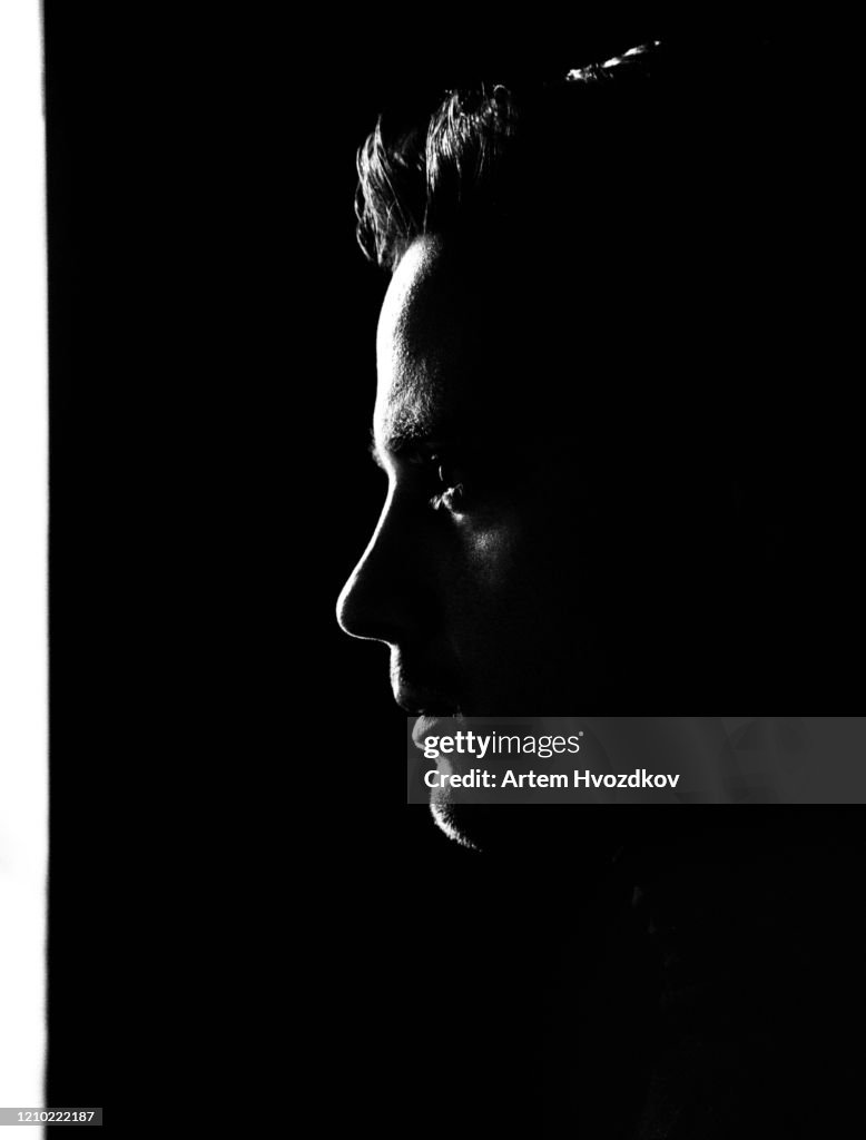 Silhouette portrait of young man