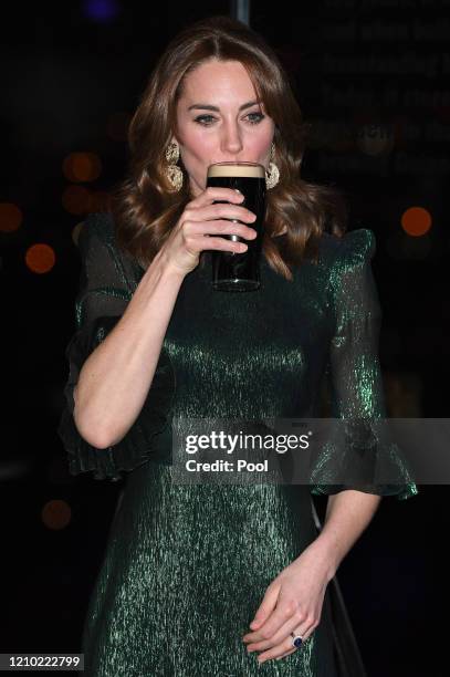 Catherine, Duchess of Cambridge drinks a Guinness at a reception hosted by the British Ambassador to Ireland Robin Barnett at the Guinness...