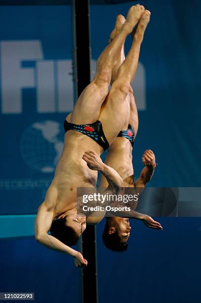China's Qin Kai and Wang Feng perform during the men's 3m synchro springboard diving at the 12th FINA World Swimming Championships at the Rod Laver...