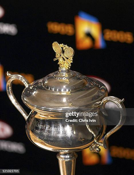 Serena Williams displays her championship trophy to the media following her defeat of Lindsay Davenport 2-6, 6-3, 6-0 in the Women's Singles Final of...