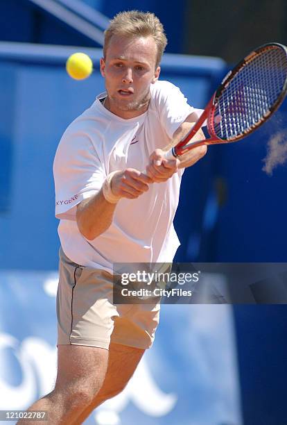 Christophe Rochus hits a backhand during a match against Gilles Muller in the first round of the Estoril Open, Estoril, Portugal on May 1, 2006.