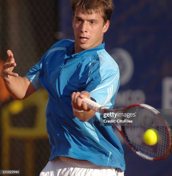 Gilles Muller in action during his match against Nicolas Lapentti during the second round of the Estoril Open at Estadio Nacional in Estoril,...