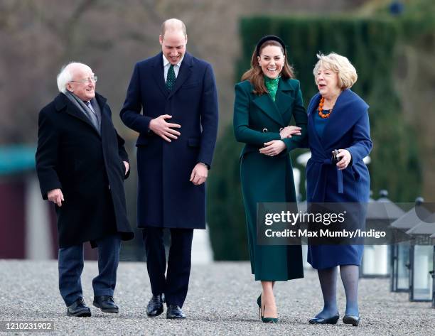 Prince William, Duke of Cambridge and Catherine, Duchess of Cambridge walk around the grounds of Áras an Uachtaráin with President of Ireland,...