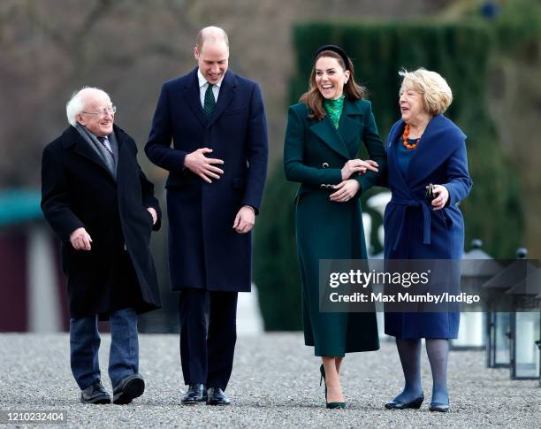 Prince William, Duke of Cambridge and Catherine, Duchess of Cambridge walk around the grounds of Áras an Uachtaráin with President of Ireland,...