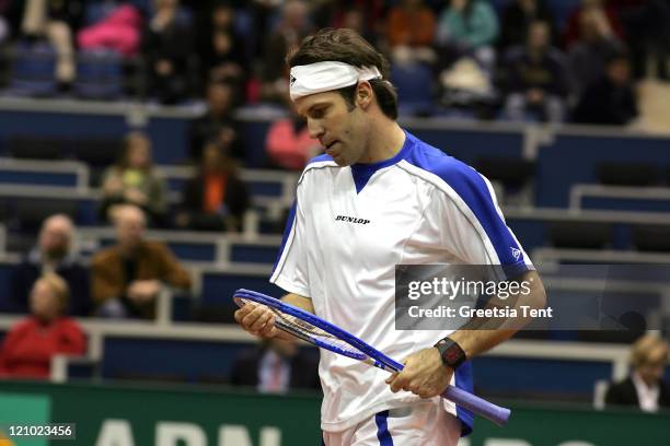 Greg Rusedski in action against Nikolay Davydenko during their second round match during the ABN AMRO World Tennis Tournament at the Ahoy' in...