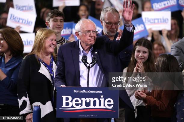 Democratic presidential candidate Sen. Bernie Sanders waves to supporters as his wife Jane Sanders smiles at his Super Tuesday night event on March...