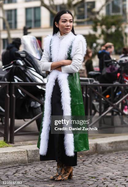 Yoyo Cao is seen wearing a Miu Miu coat outside the Miu Miu show during Paris Fashion Week: AW20 on March 03, 2020 in Paris, France.