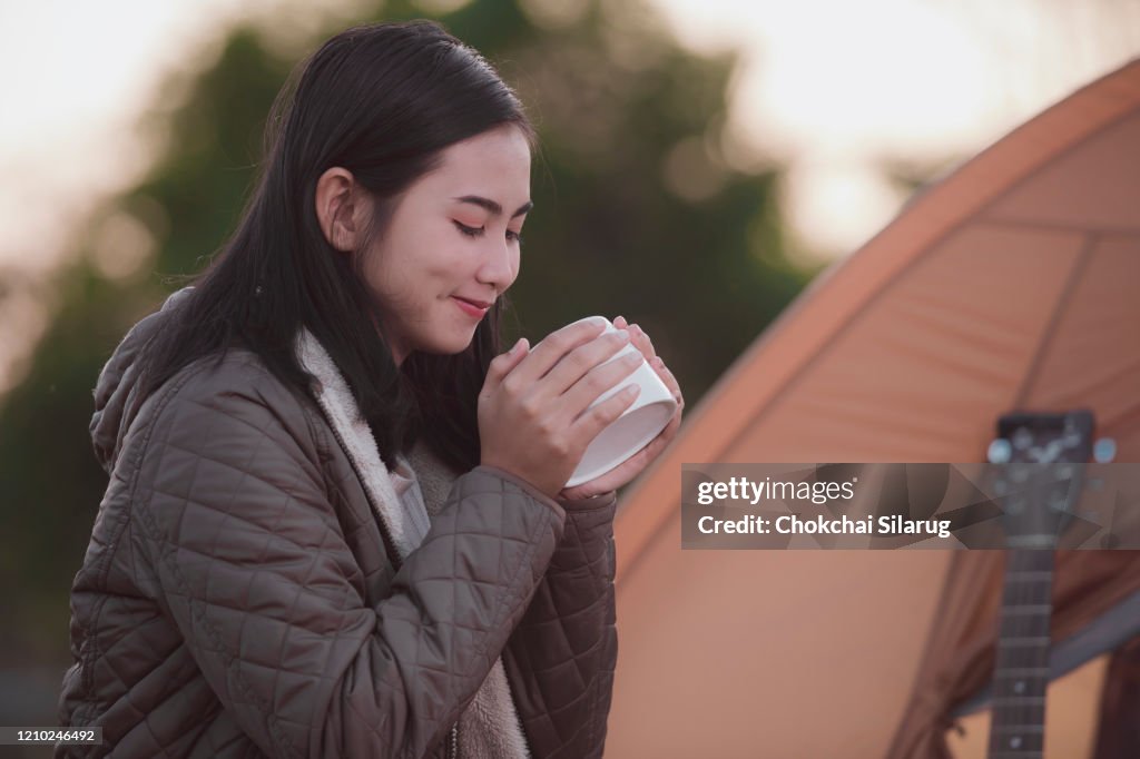 Beautiful female tourists drinking morning coffee,