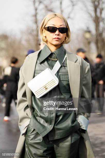 Vanessa Hong wearing Chanel white belt bag and green leather shirt outside Paris Fashion Week Womenswear Fall/Winter 2020/2021 Day Nine on March 03,...