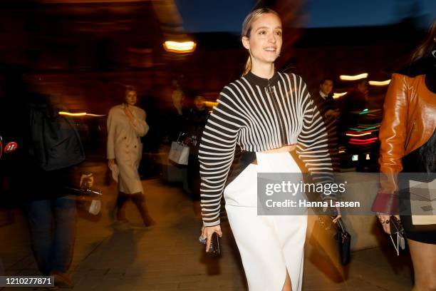 Charlotte Groeneveld wearing Louis Vuitton black and knit white jacket,white skirt and black bag outside the Louis Vuitton show during Paris Fashion...