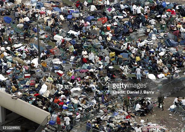 The crowd outside the Superdome in New Orleans on Saturday, September 3, 2005. The city remains under water as military helicopters evacuate people.
