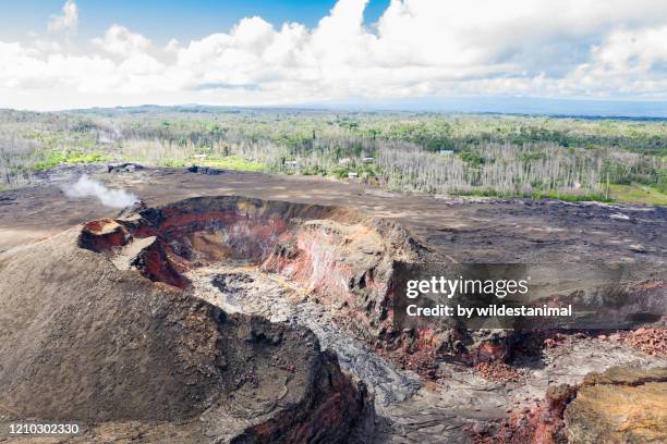 aerial view of fissure 8 which was the dominant lava producer in the may 2018 volcanic eruption which destroyed many homes in the leilani estates area forcing the evacuation of 2000 people. big island, hawaii. - hawaii volcanoes national park stock pictures, royalty-free photos & images