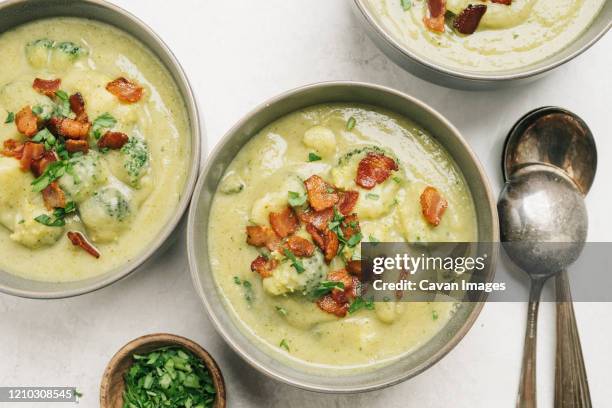 potato and broccoli soup with bacon table setting - chaudiere stock pictures, royalty-free photos & images