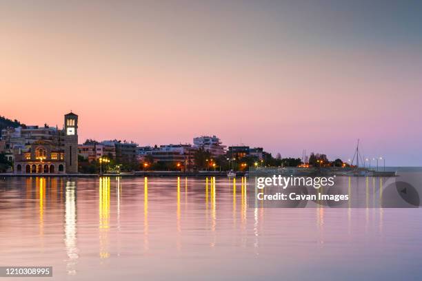 church at the seafront of volos city as seen early in the morning. - volos stock-fotos und bilder