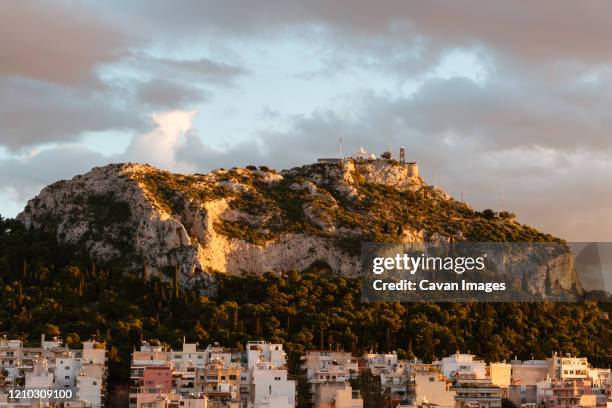 view of lycabettus hill from strefi hill in exarchia, greece. - strefi hill stock pictures, royalty-free photos & images