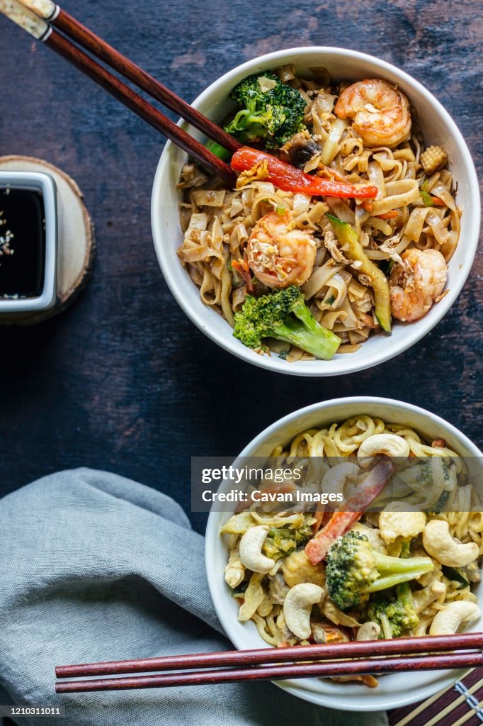 Two bowls with Pad thai noodles