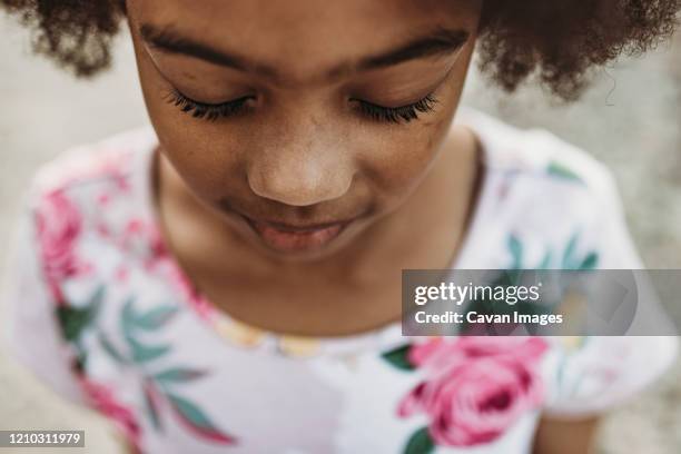 close up portrait of young school-aged  girl with closed eyes - child eyes closed stock pictures, royalty-free photos & images