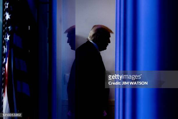 President Donald Trump departs after speaking during the daily briefing on the novel coronavirus, which causes COVID-19, in the Brady Briefing Room...