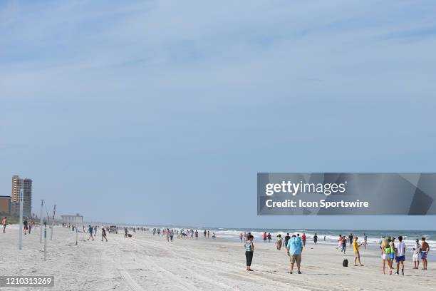 People crowded the beaches in its first open hour on April 17, 2020 in Jacksonville Beach, Fl. Jacksonville Mayor Lenny Curry opened the beaches to...