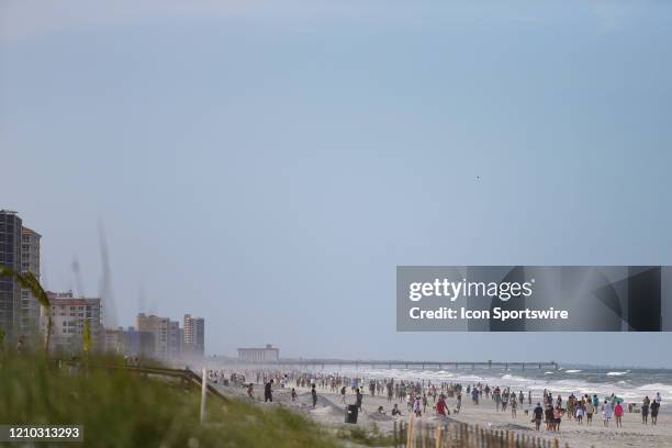 People crowded the beaches in its first open hour on April 17, 2020 in Jacksonville Beach, Fl. Jacksonville Mayor Lenny Curry opened the beaches to...