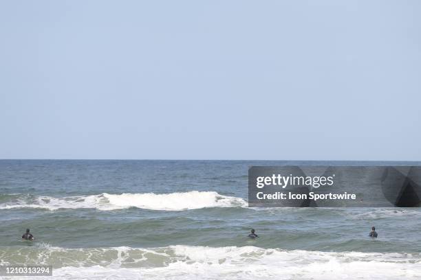 Surfers practice social distancing during the beaches first open hour on April 17, 2020 in Jacksonville Beach, Fl. Jacksonville Mayor Lenny Curry...