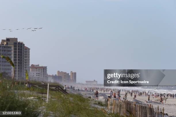 People crowded the beaches in its first open hour on April 17, 2020 in Jacksonville Beach, Fl. Jacksonville Mayor Lenny Curry opened the beaches to...