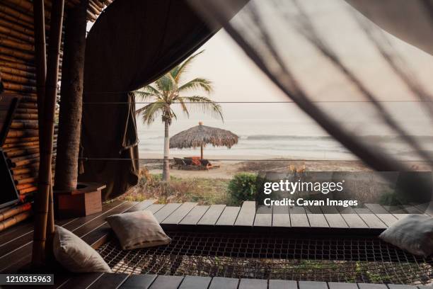 a stunning view over a calm sea at sunset - puerto vallarta stockfoto's en -beelden