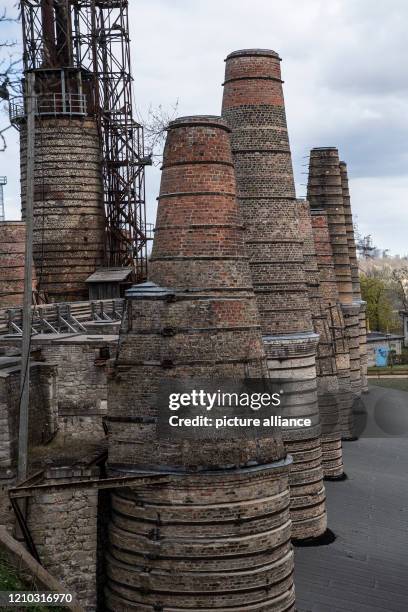 April 2020, Brandenburg, Rüdersdorf: Towers of the shaft furnace battery in the Rüdersdorf Museum Park rise into the sky. The 17ha large museum park...