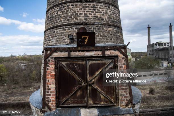 April 2020, Brandenburg, Rüdersdorf: The number "7" stands on a tower of the shaft furnace battery in the Rüdersdorf Museum Park. The 17ha large...