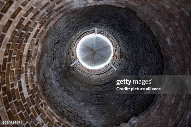 April 2020, Brandenburg, Rüdersdorf: A tower of the shaft furnace battery in the Rüdersdorf Museum Park is covered with a plate. The 17ha large...