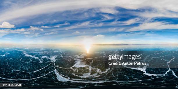 360° aerial panorama of cracked ice on lake baikal. siberia, russia. - 360度視点 ストックフォトと画像